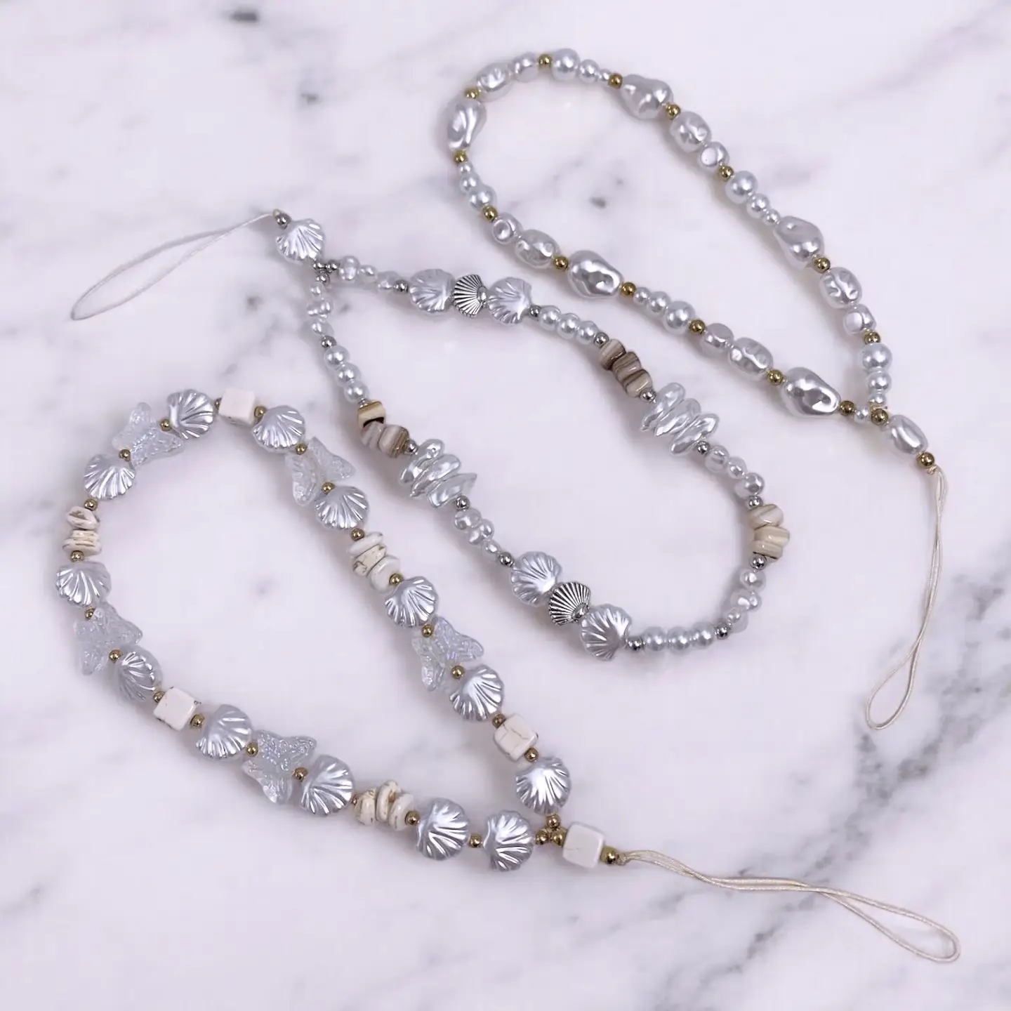 Chaîne courte de téléphone en perles